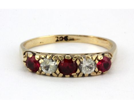 A 9ct yellow gold stone set ring, (K).