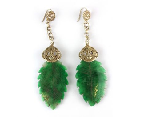 A pair of Chinese carved jade and white metal drop earrings, L. 9cm.