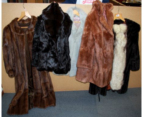 A group of vintage mink and faux fur coats and jackets.