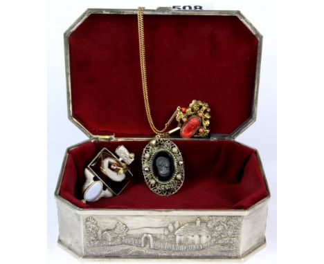 A silverplated box containing a silver, agate and opal pendant and two other items.