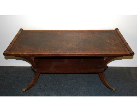 A vintage leather topped pedestal coffee table, size 104 x 49 x 48cm.