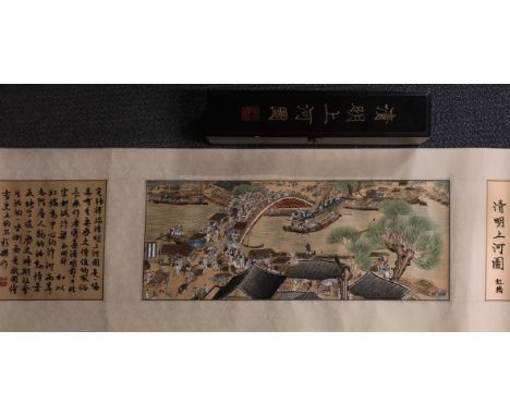 An unusual Chinese scroll of&nbsp;Kaifeng bridge, mounted hand embroidered panel with wooden presentation case, L. 65cm W. 39