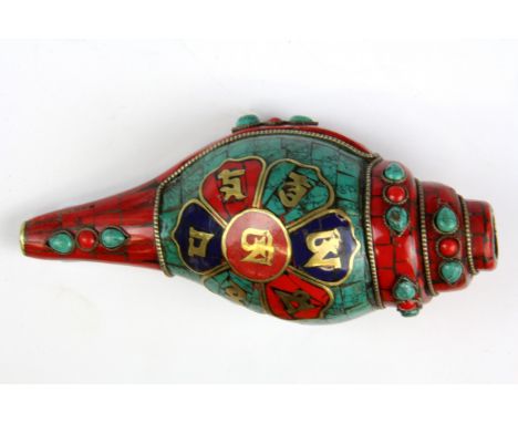 A Tibetan mosaic decorated conch shell trumpet with brass inlaid mantra, L. 15cm.