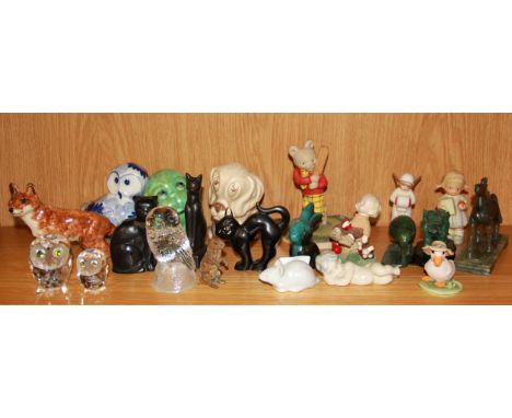 A collection of ceramic, glass and other animal figures.