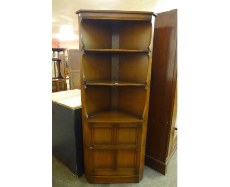 An Ercol freestanding corner cupboard