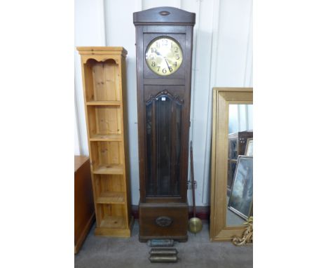 An oak triple weight longcase clock