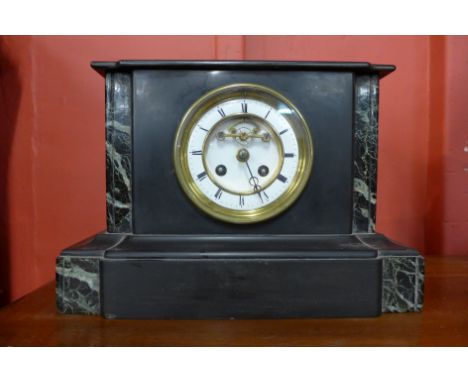 A 19th Century French Belge noir mantel clock