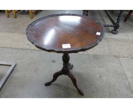 A mahogany tripod wine table