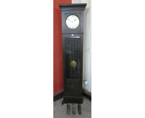 An oak triple weight longcase clock