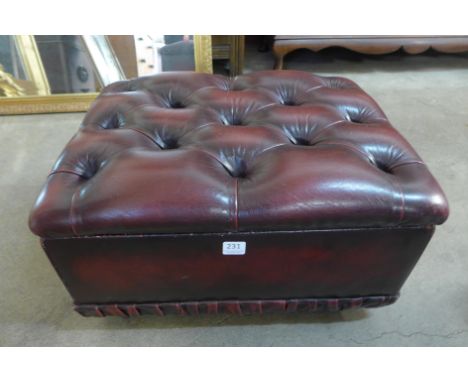 A red leather pouffe