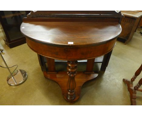 A Victorian mahogany demi-lune console table