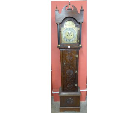 A carved oak 8-day longcase clock, the square brass dial signed M.L. Sandoz, Tamworth-in-Arden, Warwickshire