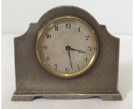 A 1920's silver free standing clock with engine turned decoration to front. Hallmarked Birmingham 1925. Approx. 10cm wide x 8