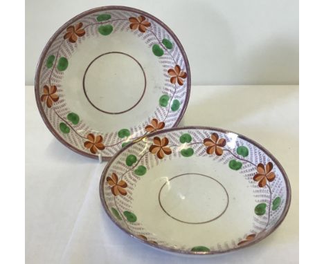 A pair of 19th century pink lustre Sunderland ceramic saucers / dishes. Decorated with orange flowers and green pea design. A