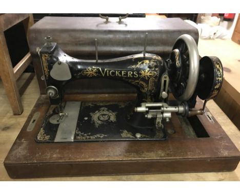 A vintage wooden cased Vickers sewing machine.  