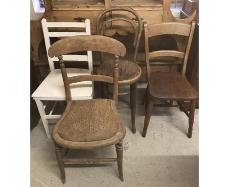 A collection of 4 vintage wooden bedroom chairs. To include small bentwood chair, ladder back chair painted white and lightwo