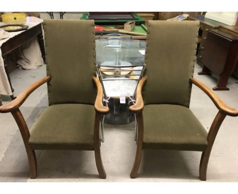 A pair of vintage dark wood framed carver dining chairs with sprung seats and green upholstery.  Approx. 109cm tall.