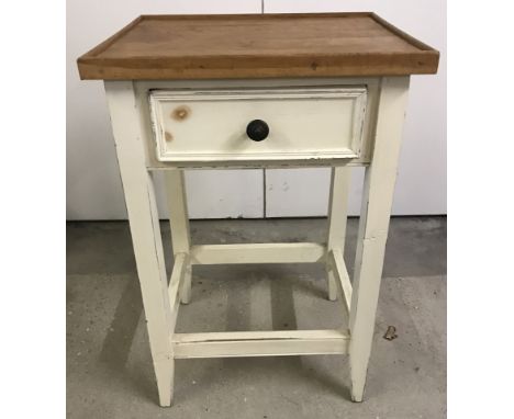 A small vintage single drawer side table with cream painted base and natural wood top.  Approx. 46cm wide x 70cm tall.