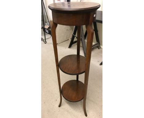 A tall vintage mahogany 3 tier circular plant stand. Some staining to top. Approx. 111cm tall x 32cm diameter.