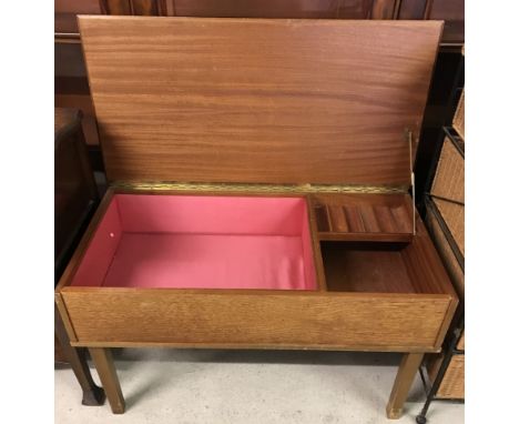 A vintage teak Sewing/work box with lift up lid. Interior thread compartments, fully lined. Approx. 78 x 45.5 cm tall.