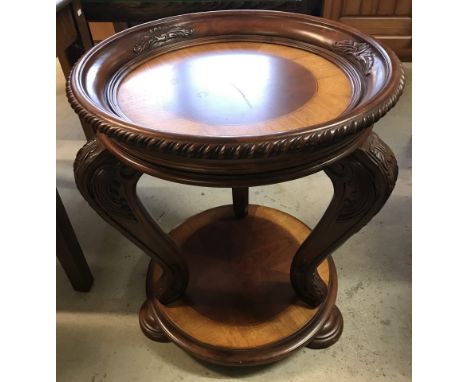 A reproduction Chippendale style circular occasional table with lift off tray. Carved detail to legs and top. Approx. 61cm di