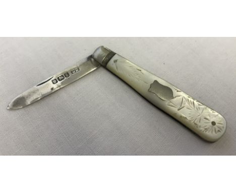 A silver and mother of pearl handled fruit knife with empty cartouche and butterfly decoration. Hallmarked Sheffield 1899. 