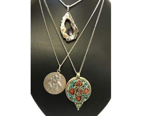 3 large decorative pendants on silver chains. 1) Large silver St. Christopher's medal approx 3cm in diameter. 2) A natural am