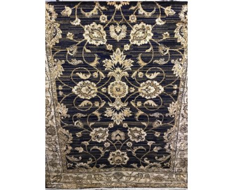 A new Ziegler pattern rug with navy blue background. Beige and gold colouration. Approx. 190cm x 140cm.