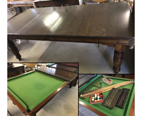 A full size slate bed mahogany pool table with 4 leaves to convert to dinning room table. Complete with score boards, cue's r