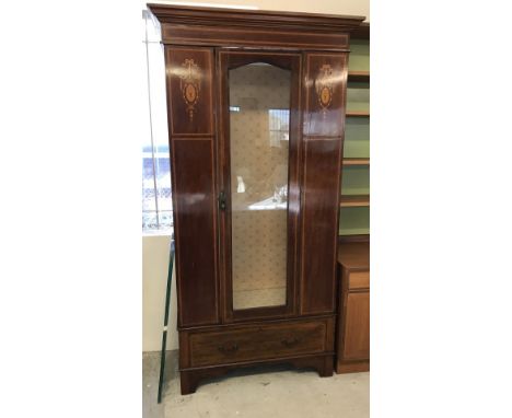 A vintage mahogany single door wardrobe, been converted to a glass cabinet. With inlaid detail to front. Mirrored panel has b