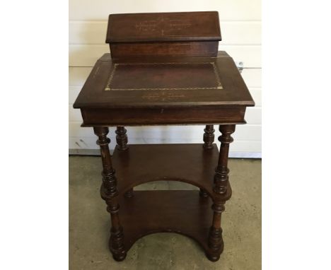 A vintage ladies writing desk with inlay and leather detail to stationery box and slope. 2 under shelves with turned column s