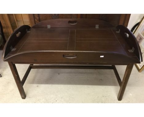 A vintage dark wood butlers tray and low stand.  Approx. 71cm x 103cm x 58cm total height.
