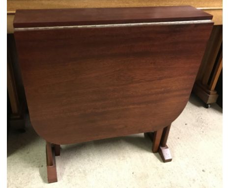 A small modern mahogany effect drop leaf gate leg table.  Approx. 69cm wide x 74cm tall.