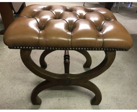 A vintage x frame leather button topped stool. Stud detail to edge of leather. 