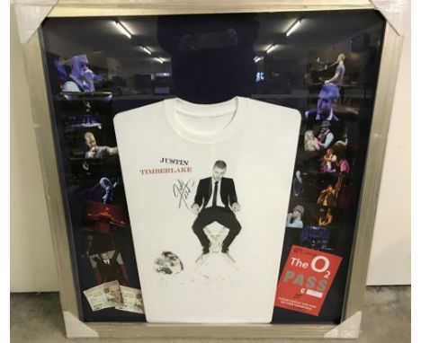 A framed and glazed Justin Timberlake signed T shirt montage from the Futuresex/loveshow world tour. Includes tickets, photos
