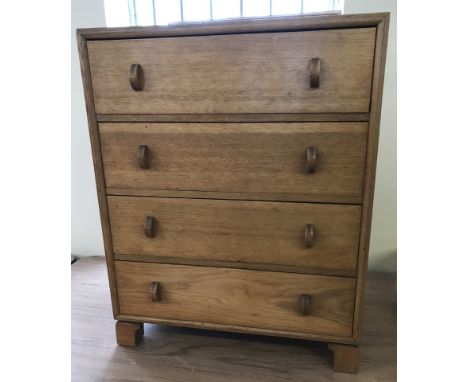 A 4 drawer light oak vintage solid wood small chest of drawers.  Approx 61 x 76.5cm tall.
