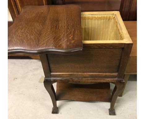 A vintage dark wood slide top sewing box by Morco. With baize lined fold out top. Approx. 47cm x 65cm tall.