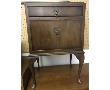 A vintage dark wood cabriole leg bedside cabinet. With front drawer and pull down cupboard. Approx 48 x 72cm tall.