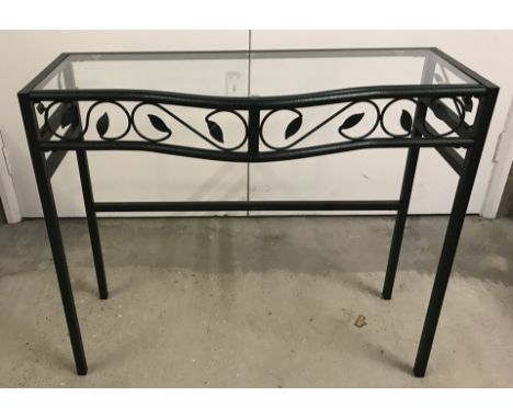A modern wrought iron hall table / console table with glass top. Scroll and leaf design to front and sides. Approx. 85cm wide