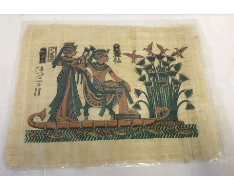 An Egyptian painting on papyrus of green and gold colouration.  