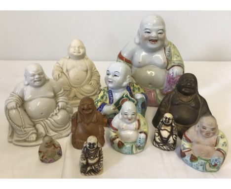 A collection of 11 Buddha figures. To include wooden, ceramic and resin. 