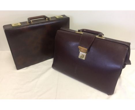 2 vintage briefcases. One leather, the other faux leather.  