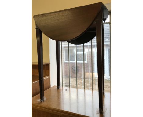 A Mahogany vintage oval drop leaf table with one side drawer.  Approx. 61 x  73 cm tall.