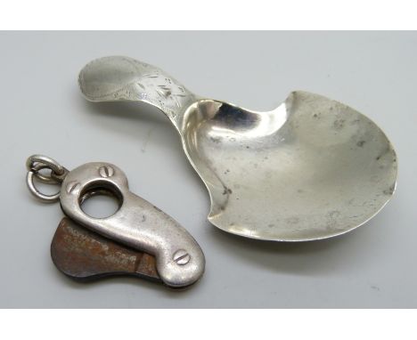 A silver caddy spoon, Birmingham 1896, and a Victorian silver mounted cigar cutter, Birmingham 1892