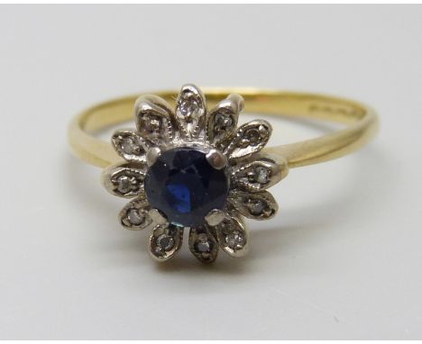 An 18ct gold, sapphire and diamond cluster ring, 3.1g, Q, hallmark worn