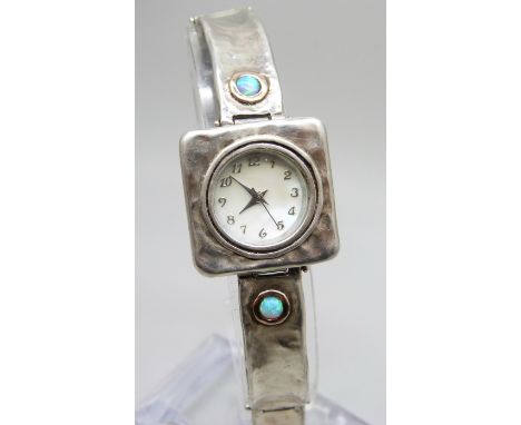 A designer brutalist silver and synthetic opal wristwatch, signed
