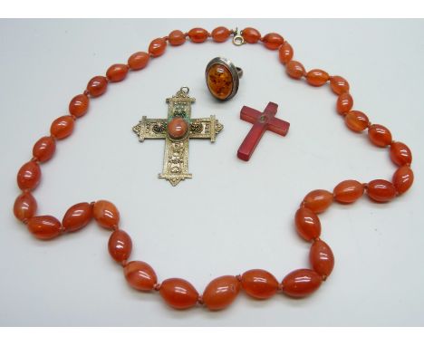 A bead necklace, a silver cross pendant, one other a/f, and a silver and amber ring, J