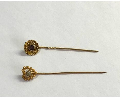 2 antique dutch gold stick pins acid test at least 14ct one set wit pearl the other an amethyst measure approx 5.1cm weight 1