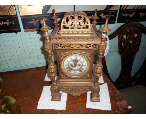 A 19th century gilt metal cased lantern-type mantle clock, the American eight day gong striking movement faced by Ivorine Rom