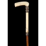 A PARTRIDGE WOOD DRESS CANE, with 'T' section silver and plated handle, silver collar and brass